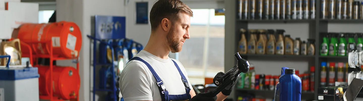Service technician installing a genuine Ford part at Marlow Ford