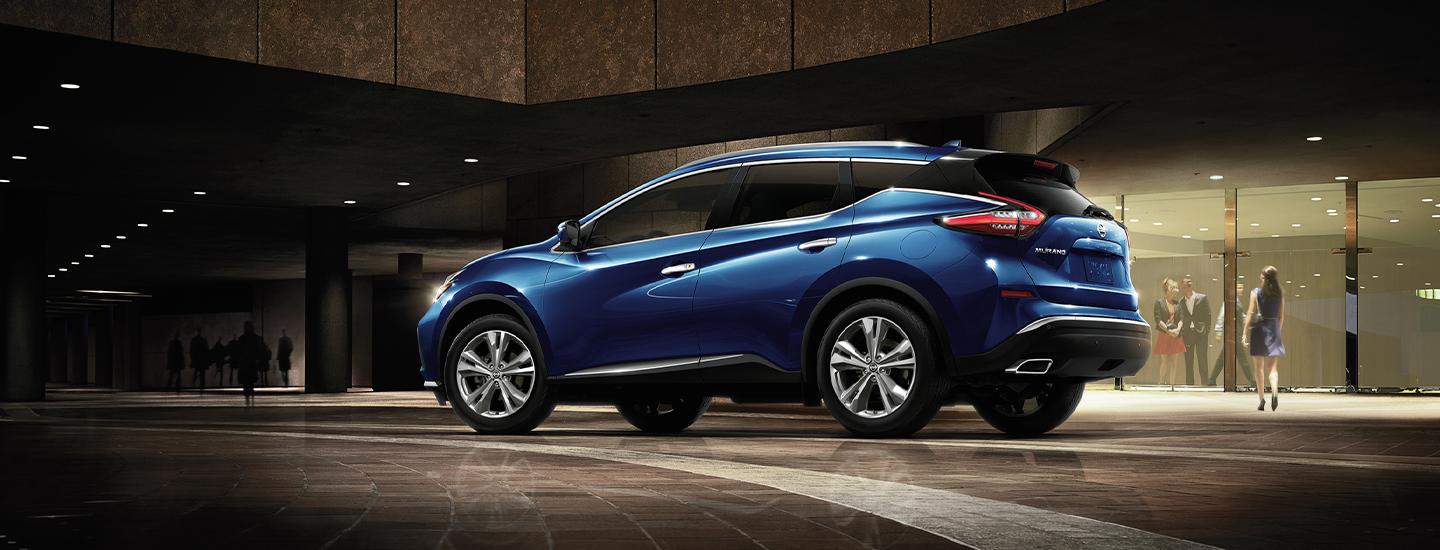 Blue 2021 Nissan Murano parked outside a store