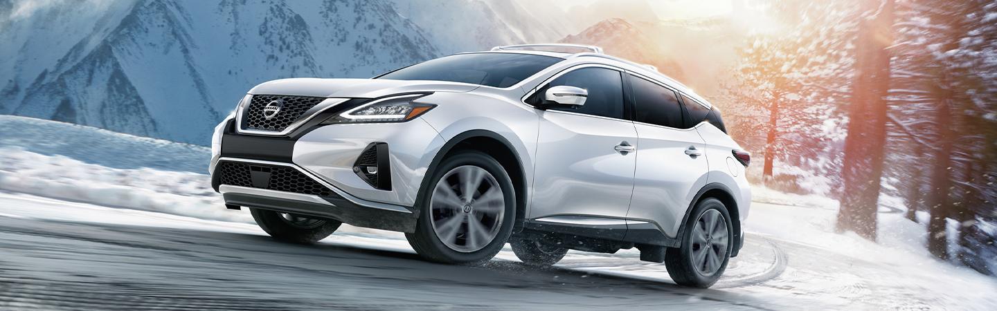 Whiote 2021 Nissan Murano driving in the snow