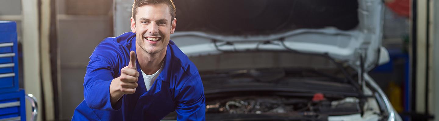 A happy service technician giving a thumbs up