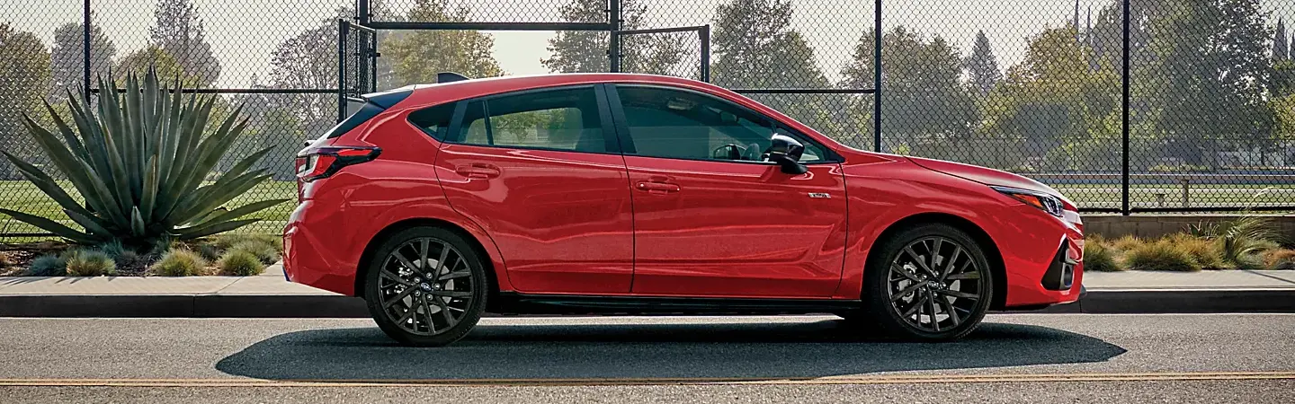 2024 Subaru Impreza vs Honda Civic blue front view