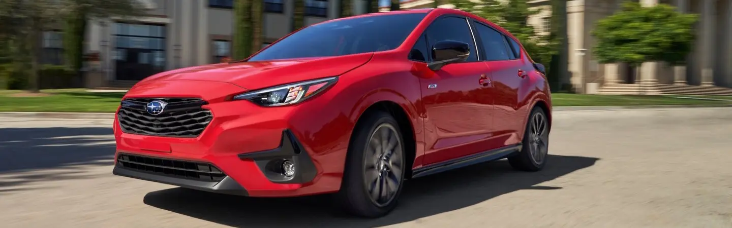 2024 Subaru Impreza vs Honda Civic blue front view