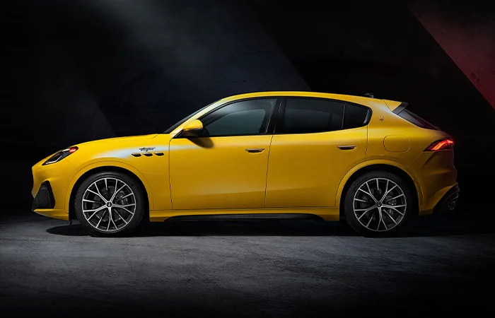 Side view of a parked yellow Maserati Grecale
