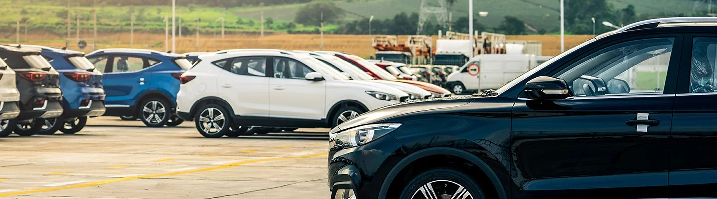 multiple cars parked in a parking lot