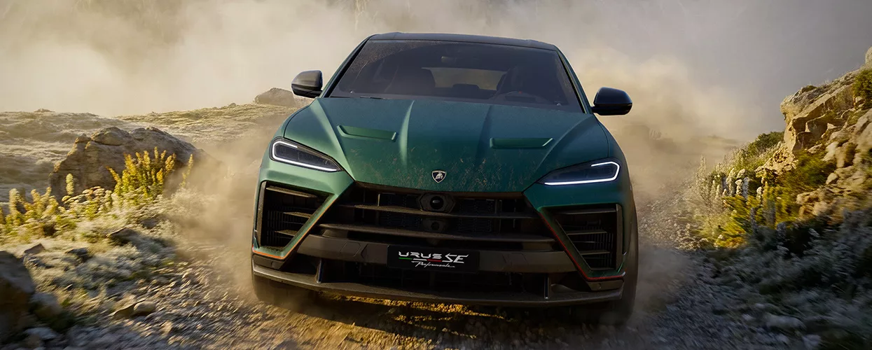 Lamborghini Urus driving on a dirt path
