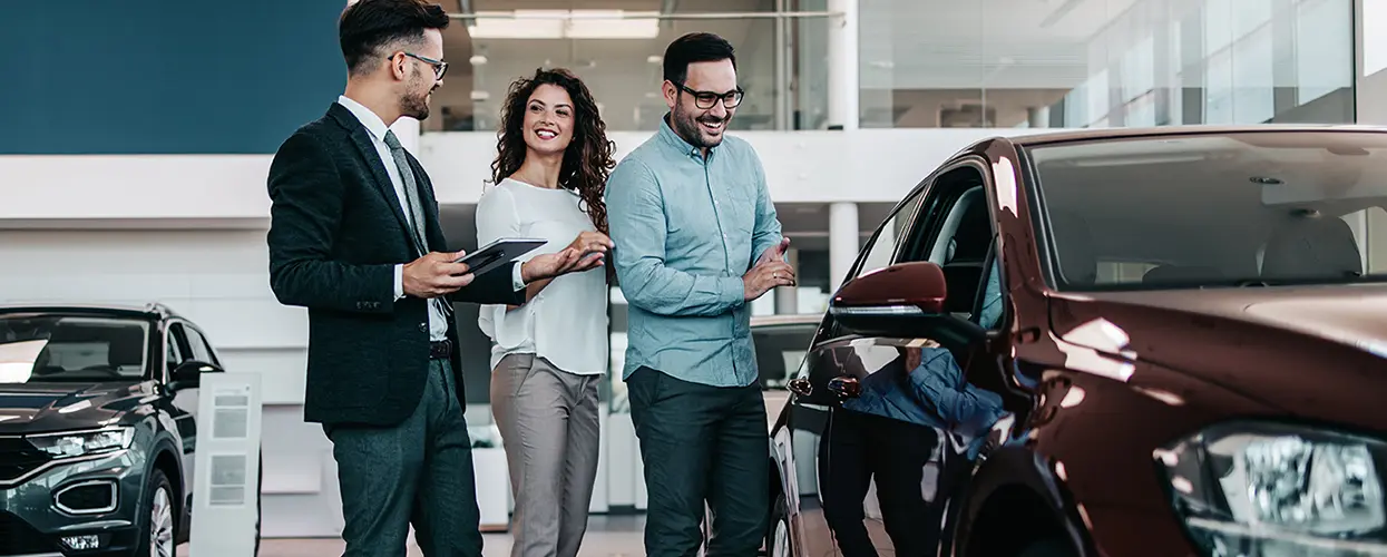people car shopping in showroom