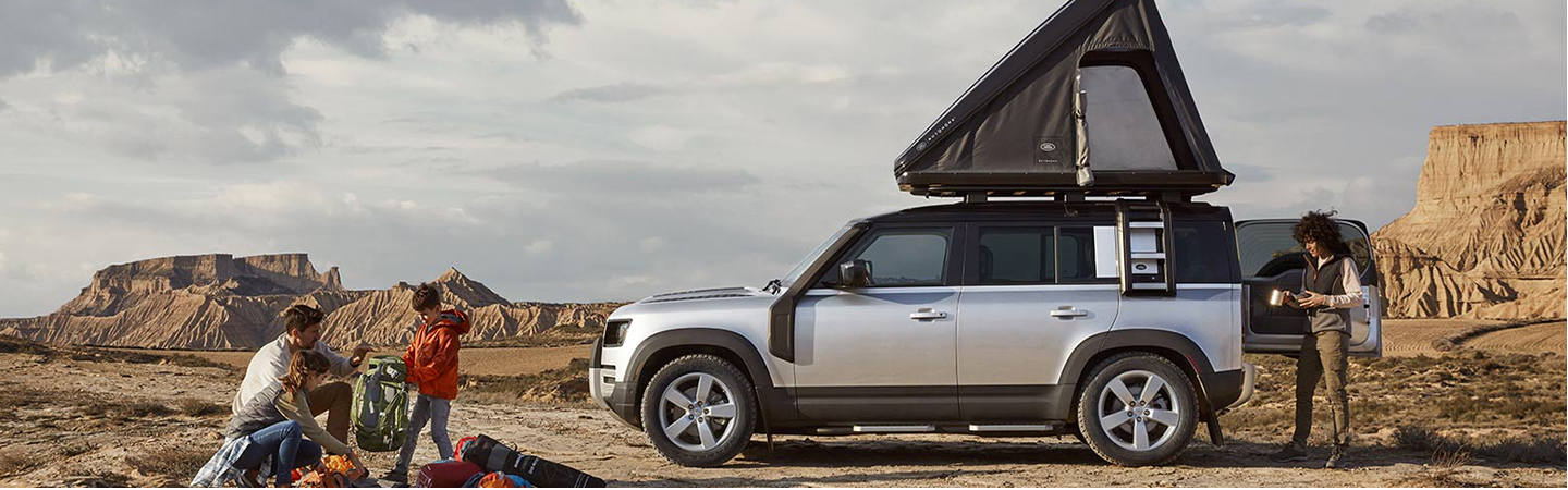 2024 Land Rover Defender side front in silver colour