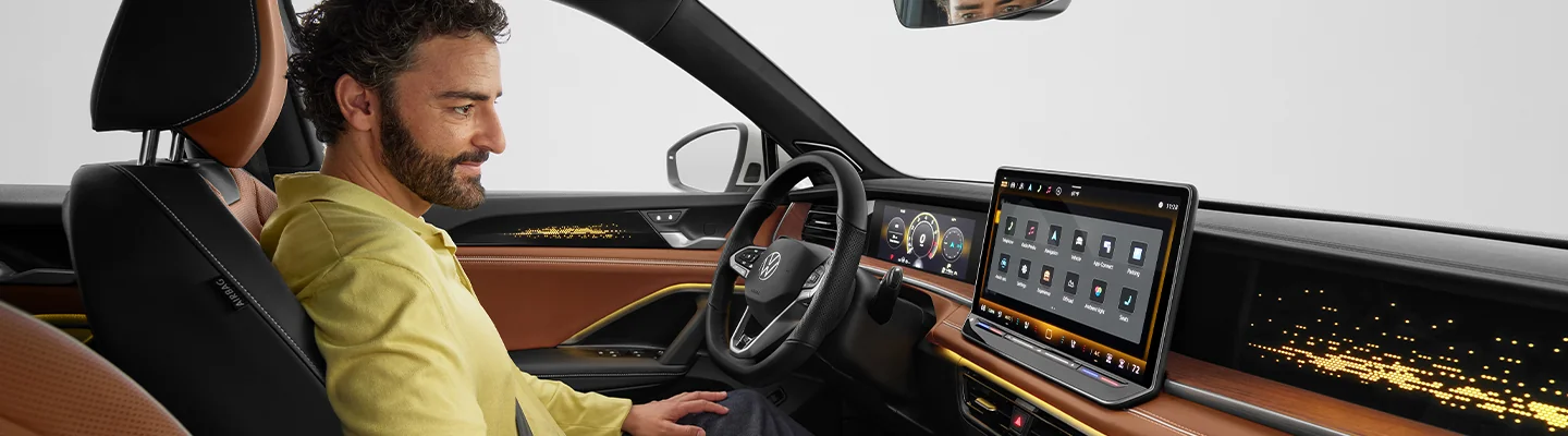 a person sitting in car admiring the interior featues