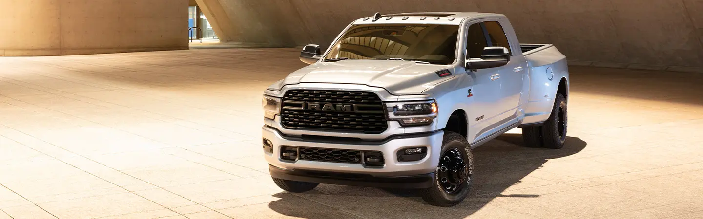 2024 RAM 3500 vs Ford F-350 black color front view