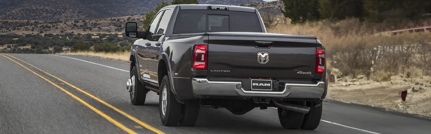 2024 RAM 3500 vs Ford F-350 black color back view