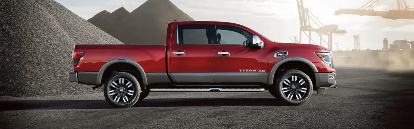 passenger side view of a 2024 Nissan Titan XD