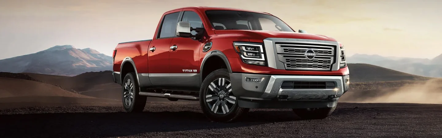 front view of a red 2024 Nissan Titan XD