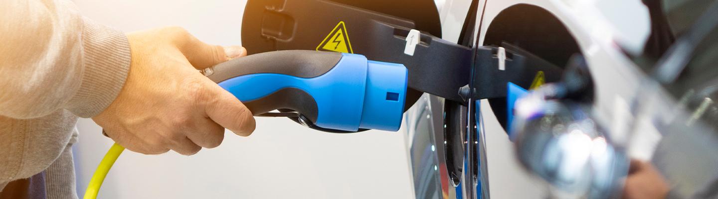 person about to charge electric car