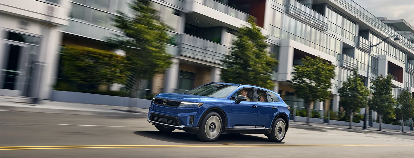 blue 2025 Honda Prologue driving