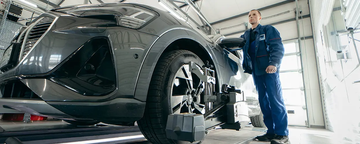 Technician working on wheels in service bay at Toyota of Tampa Bay