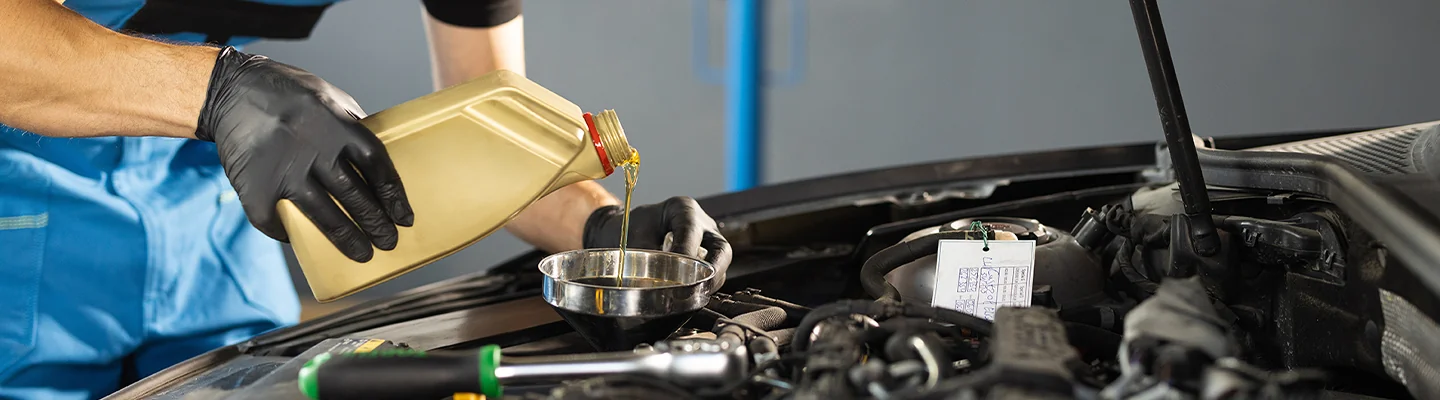 Service tech changing oil