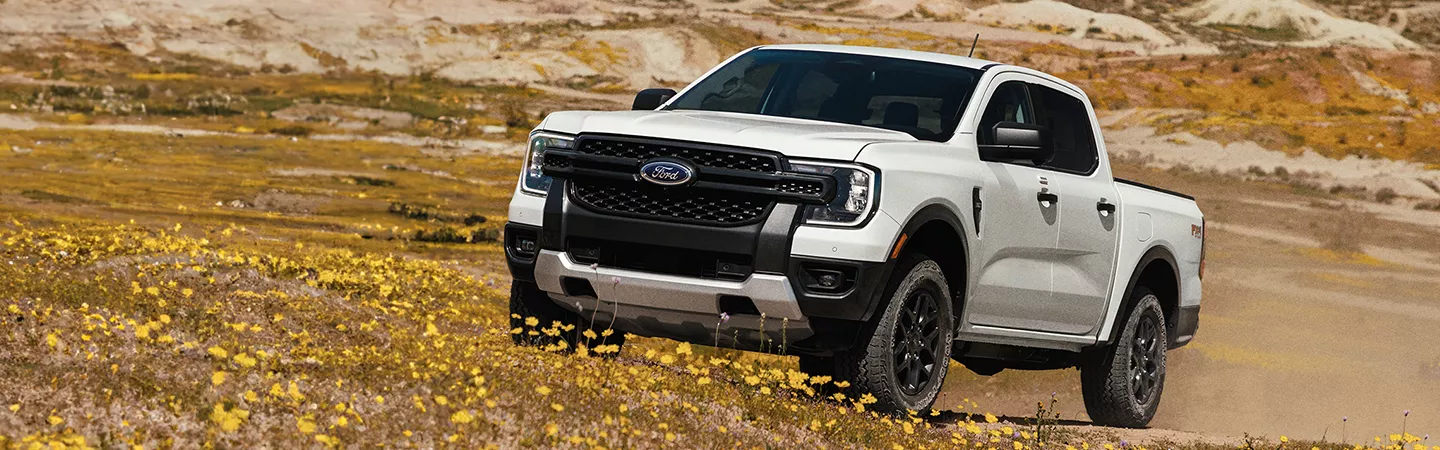 2025 Ford Ranger Raptor® driving on a dirt road