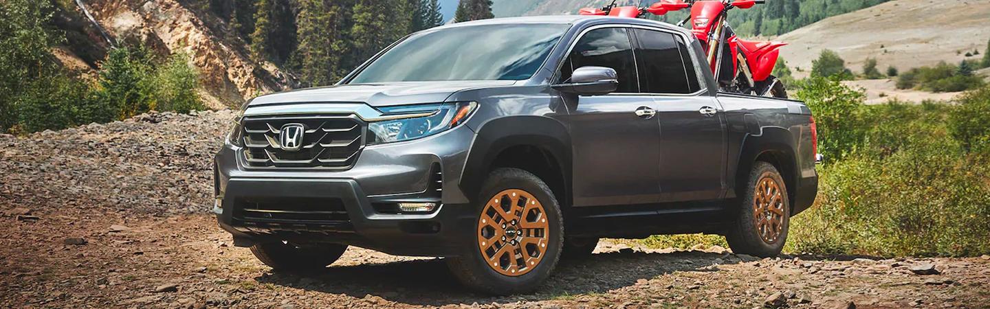 2021 Passport with 2 dirt bikes in back offroad parked