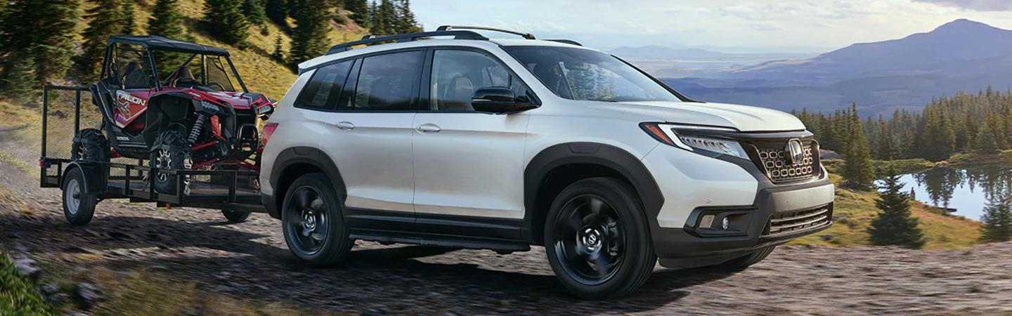 2021 Passport pulling trailer with ATV on it