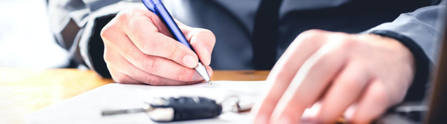Signing lease documents for a brand new car