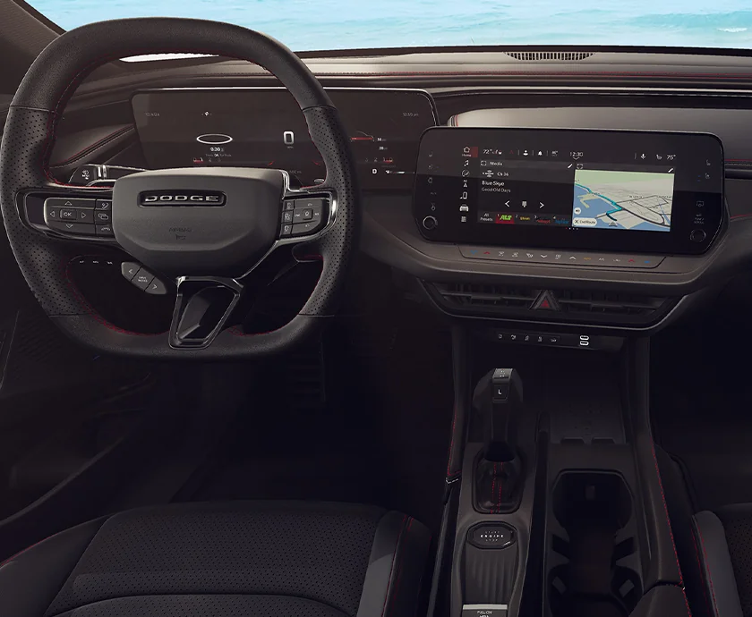 Interior view of the dashboard and tech in the front seat of a 2026 Dodge Charger