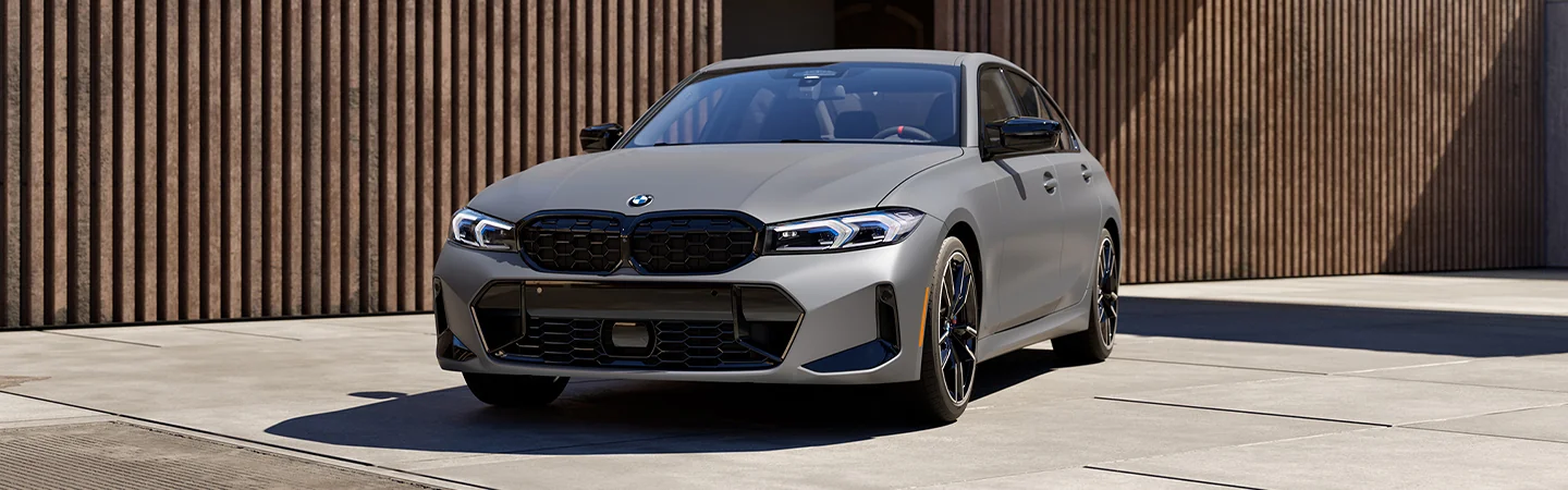 Front view of BMW 330i parked in the city