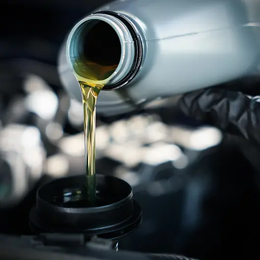 pouring oil into crankcase