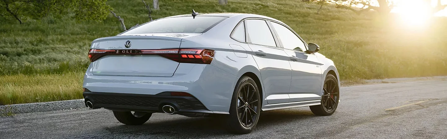 back view of a parked 2024 Volkswagen Jetta GLI on a raod