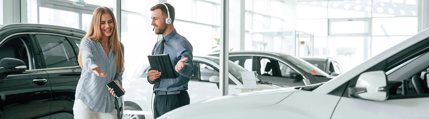 Car salesman with a customer at BMW of Pompono