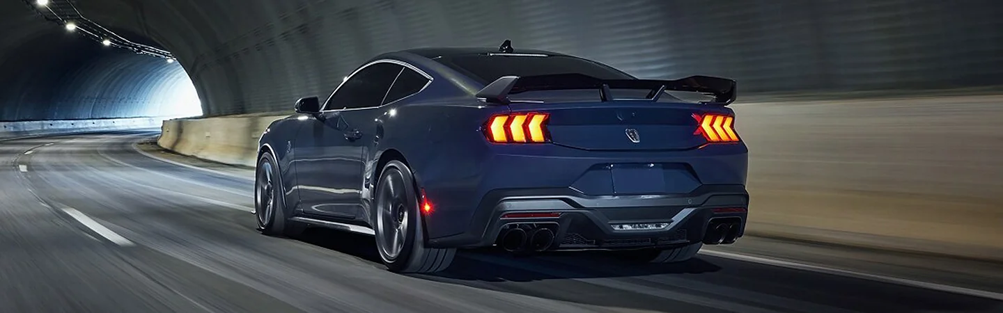 rear view at night of a 2025 Ford Mustang
