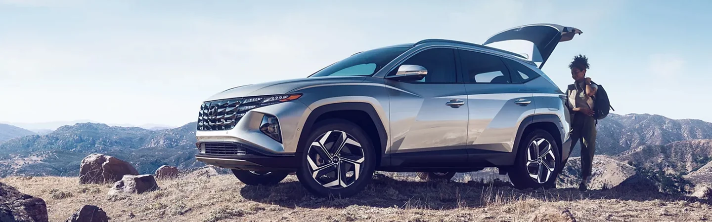 2024 Hyundai Tucson vs Palisade white color side view