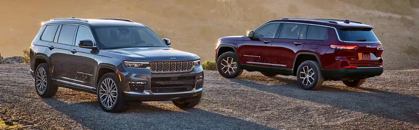 2024 Kia Sorento vs Jeep Grand Cherokee front side in black back side in red 