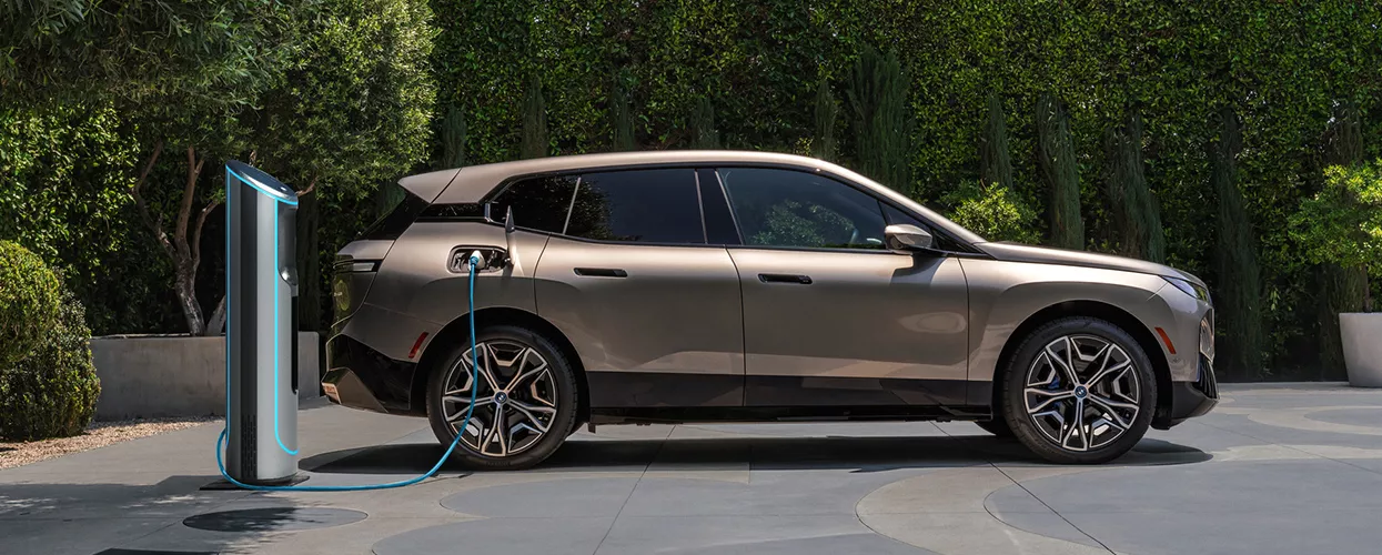 2026 BMW iX charging at a charging station