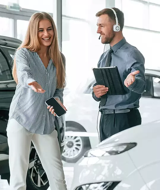 Customers reviewing vehicle financing information