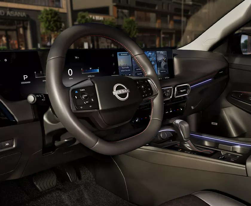 2027 Nissan Sentra interior showing steering wheel dash area