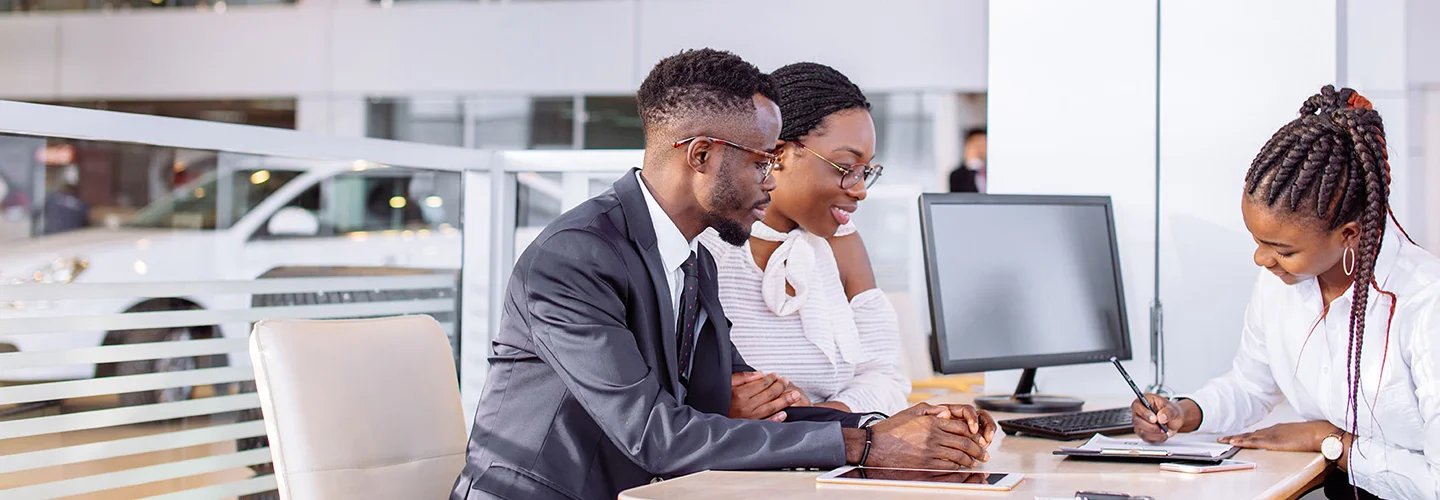 people in car showroom
