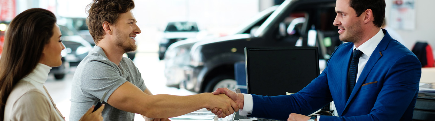 shaking hands over a car deal
