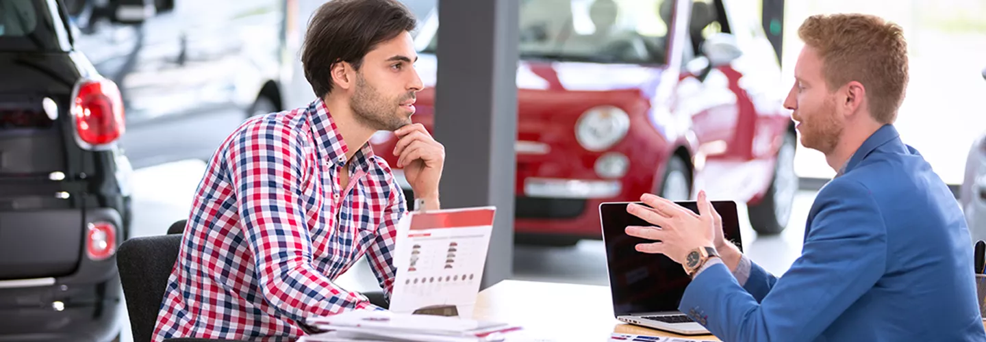 Sales person talking to a customer about there MINI Lease Return in Coconut Creek, FL