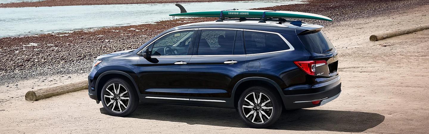 Honda Pilot is parked near the river