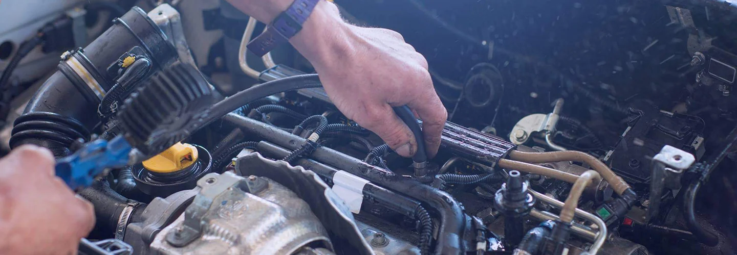 Service technician working on an engine