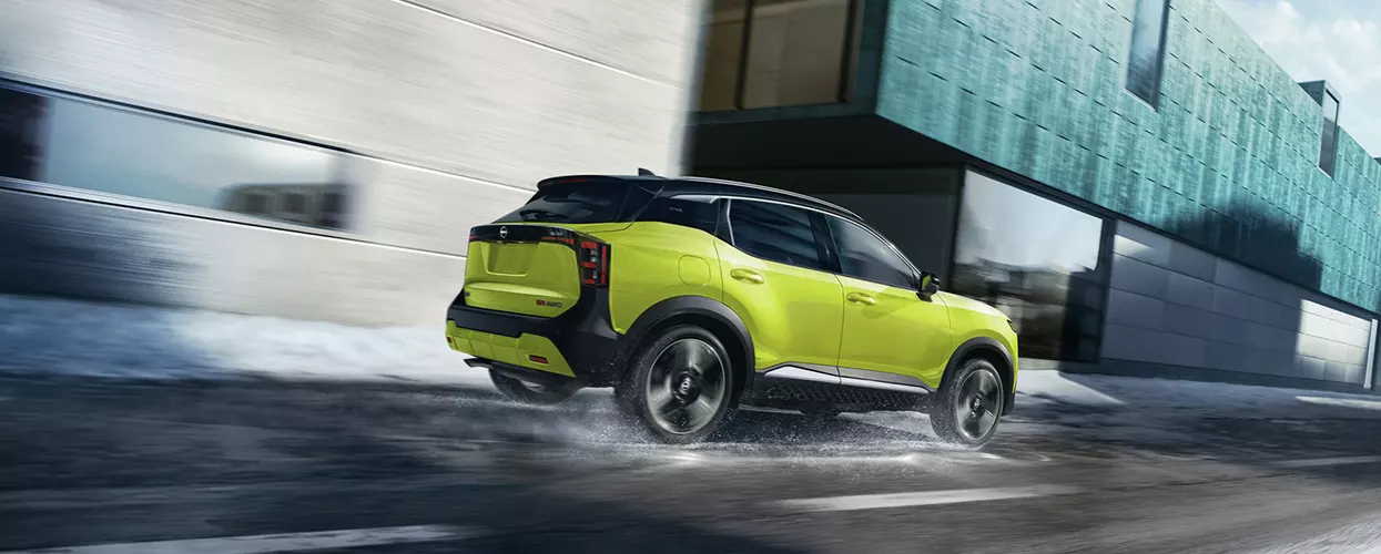 a look at a bright green Nissan Kicks from rear view
