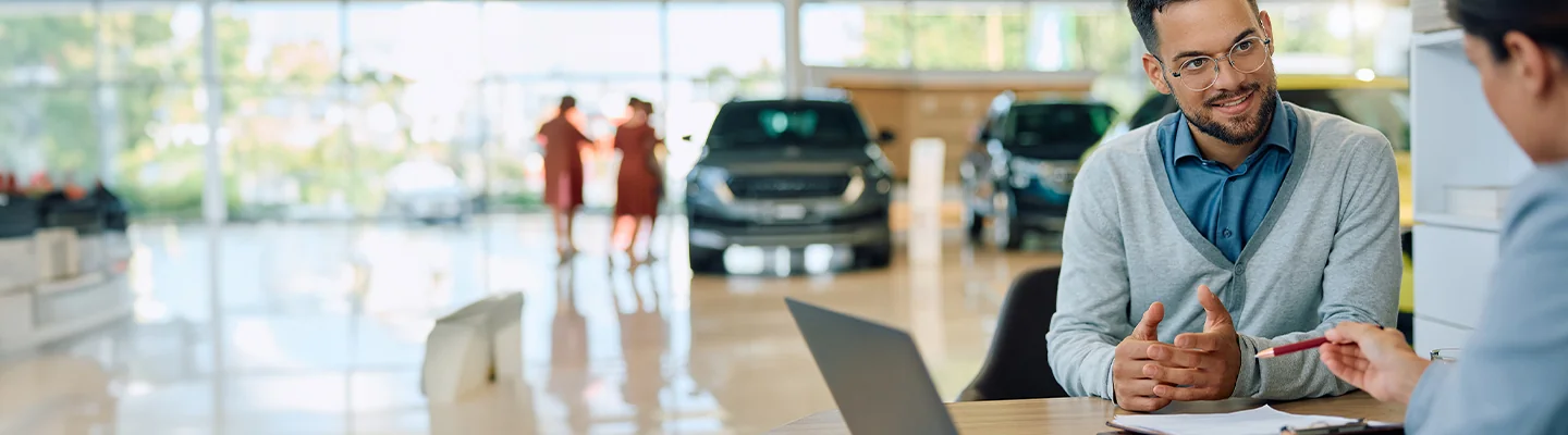 Sales person talking with customer about leasing options