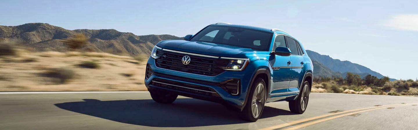 2024 Volkswagen Atlas vs Atlas Cross Sport blue color front view