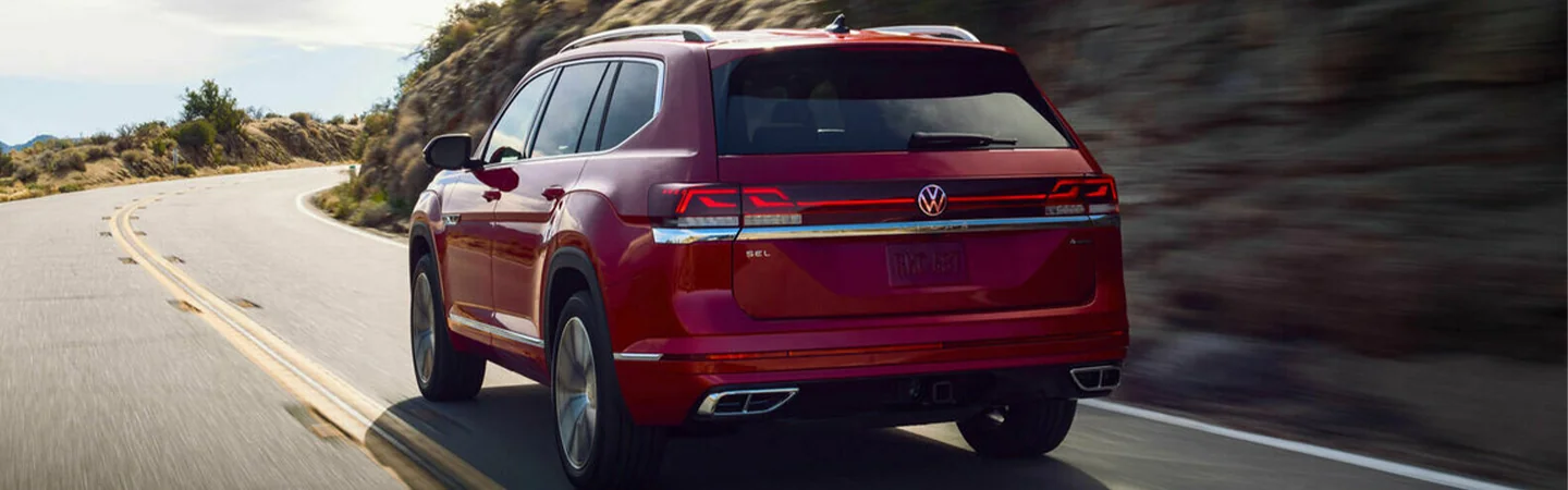 2024 Volkswagen Atlas vs Atlas Cross Sport red color back view