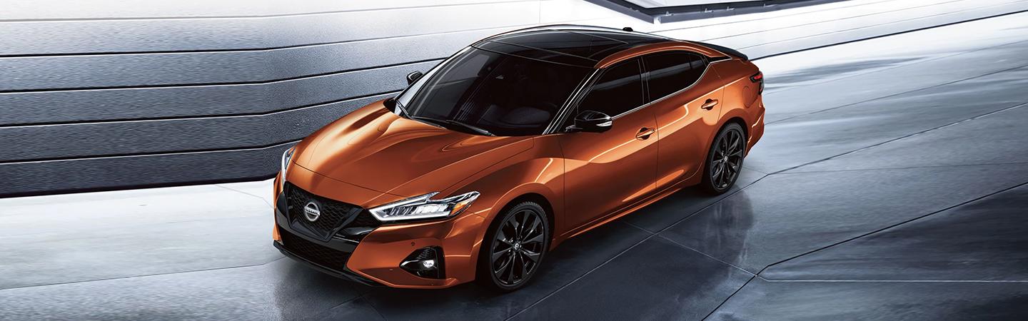 top view of an orange Nissan Maxima