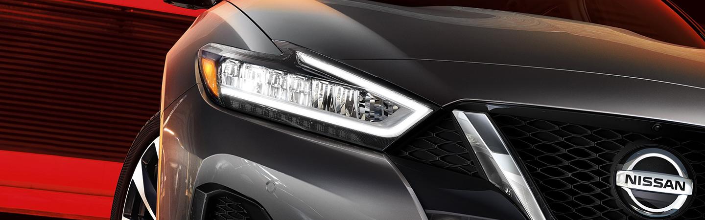 front right headlight closeup of a Nissan Maxima