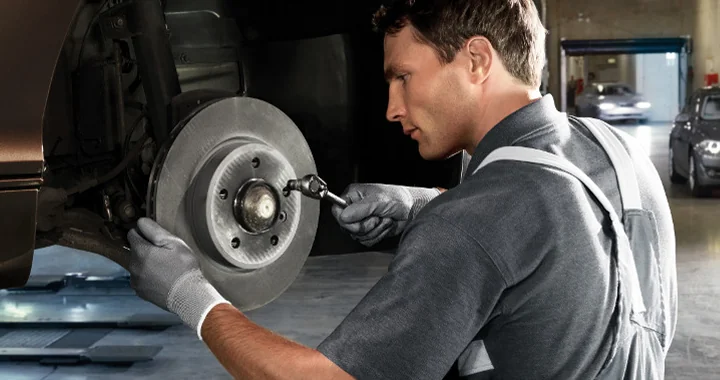 Mechanic checking brakes