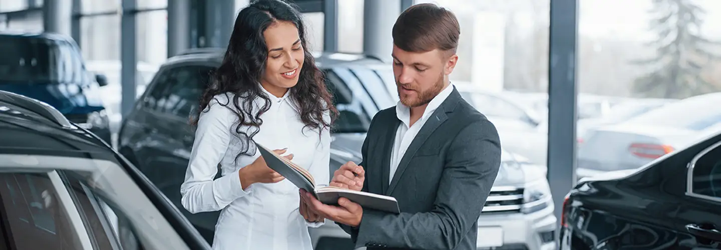 people shopping for a new car at our dealership showroom