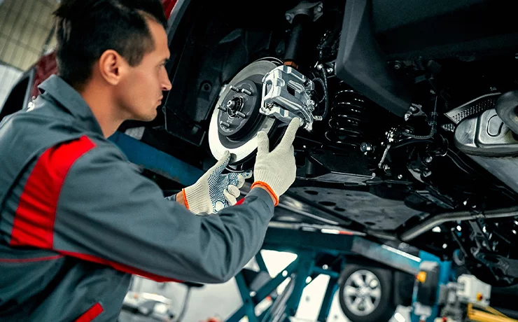 tech working under car