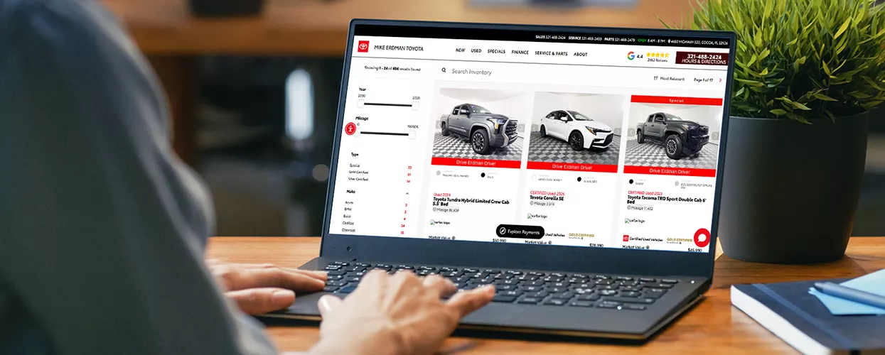 Customer using the Mike Erdman Toyota website on a laptop